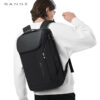 Black BANGE 5-7 Day Travel Backpack worn on the back, modern travel laptop backpack with clean urban style