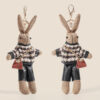 Cute rabbit bag charm keychain wearing patterned jacket and black shorts