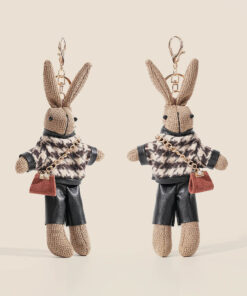 Cute rabbit bag charm keychain wearing patterned jacket and black shorts