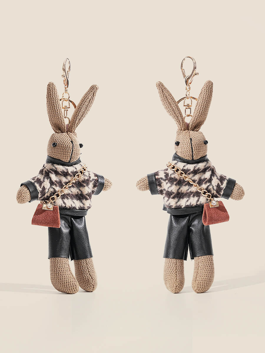 Cute rabbit bag charm keychain wearing patterned jacket and black shorts
