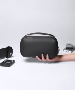 Tech Pouch (MARK RYDEN MR-3101) handheld organizer in Classic Black, showing compact carry size with top handle on a desk setup.